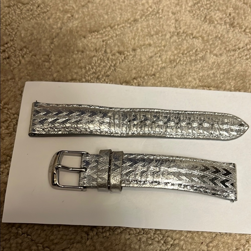 Silver leather Michele watch band. 18” long.
Beautiful and in great condition.